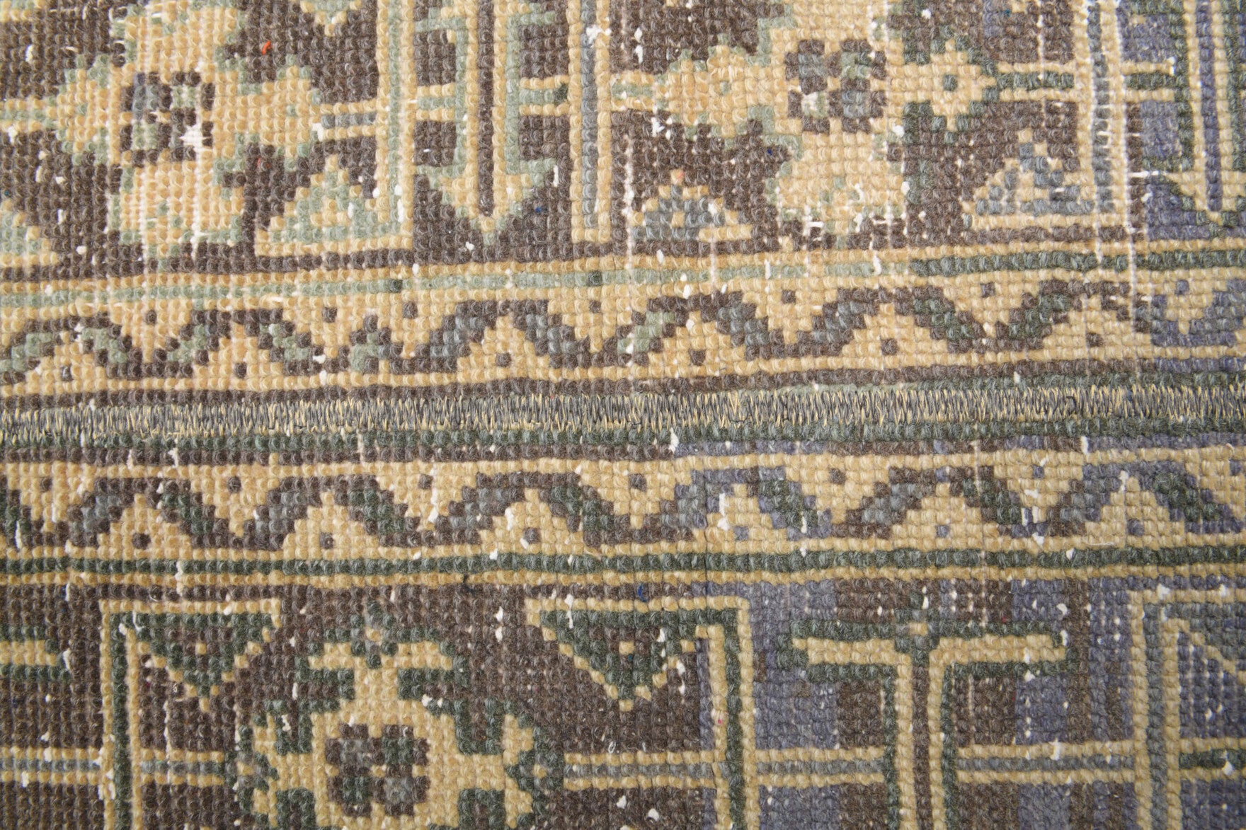 Amaranthrhoe runner: 1970s handmade Anatolian runner with oriental motifs and fabric backing