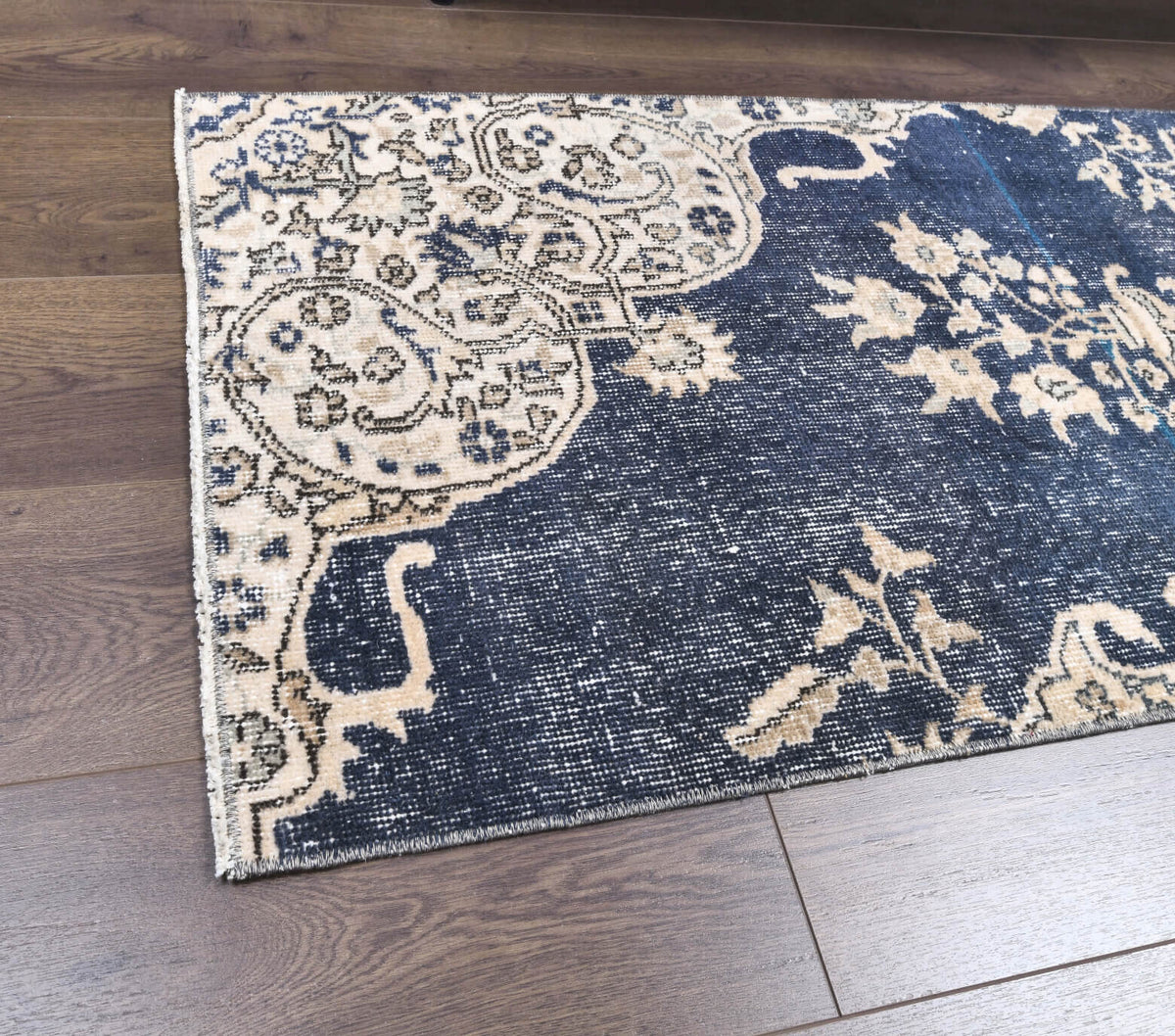 Hippopetra runner: 1970s handmade Anatolian runner with floral motifs and cotton backing