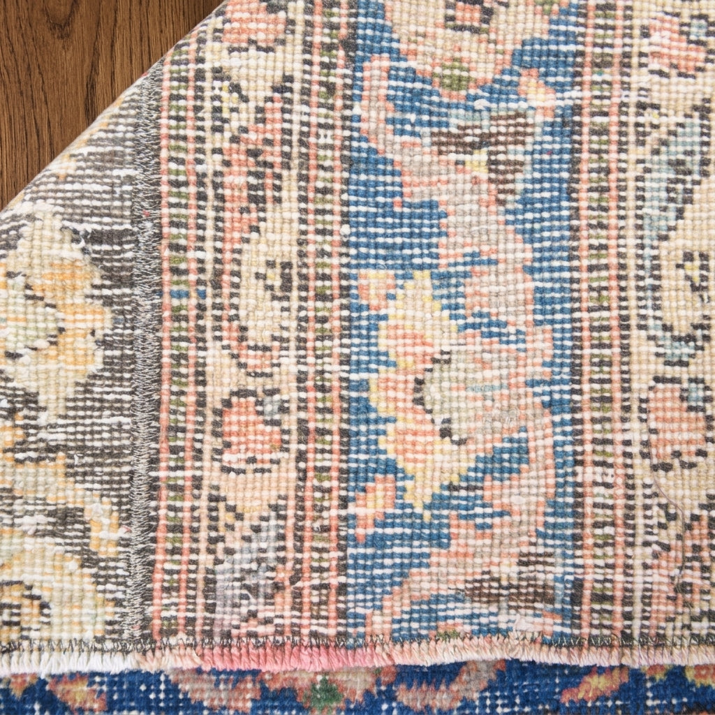 Ikat pattern on the Astrapnoe vintage patchwork runner rug – handmade in Anatolia, Turkey