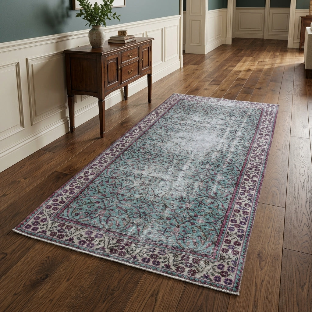 Floral and bordered pattern on the Delphiphaessa distressed vintage area rug – handmade in Anatolia, Turkey