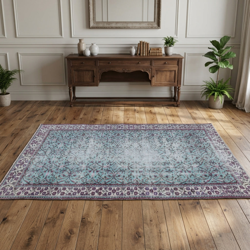 Floral and bordered pattern on the Delphiphaessa distressed vintage area rug – handmade in Anatolia, Turkey