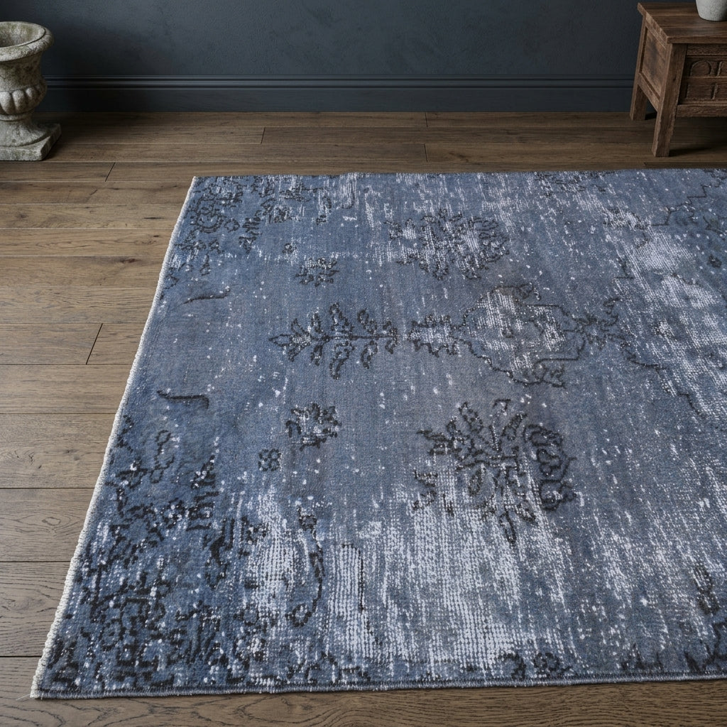 Floral pattern on the Damlapare overdyed vintage area rug – handmade in Anatolia, Turkey