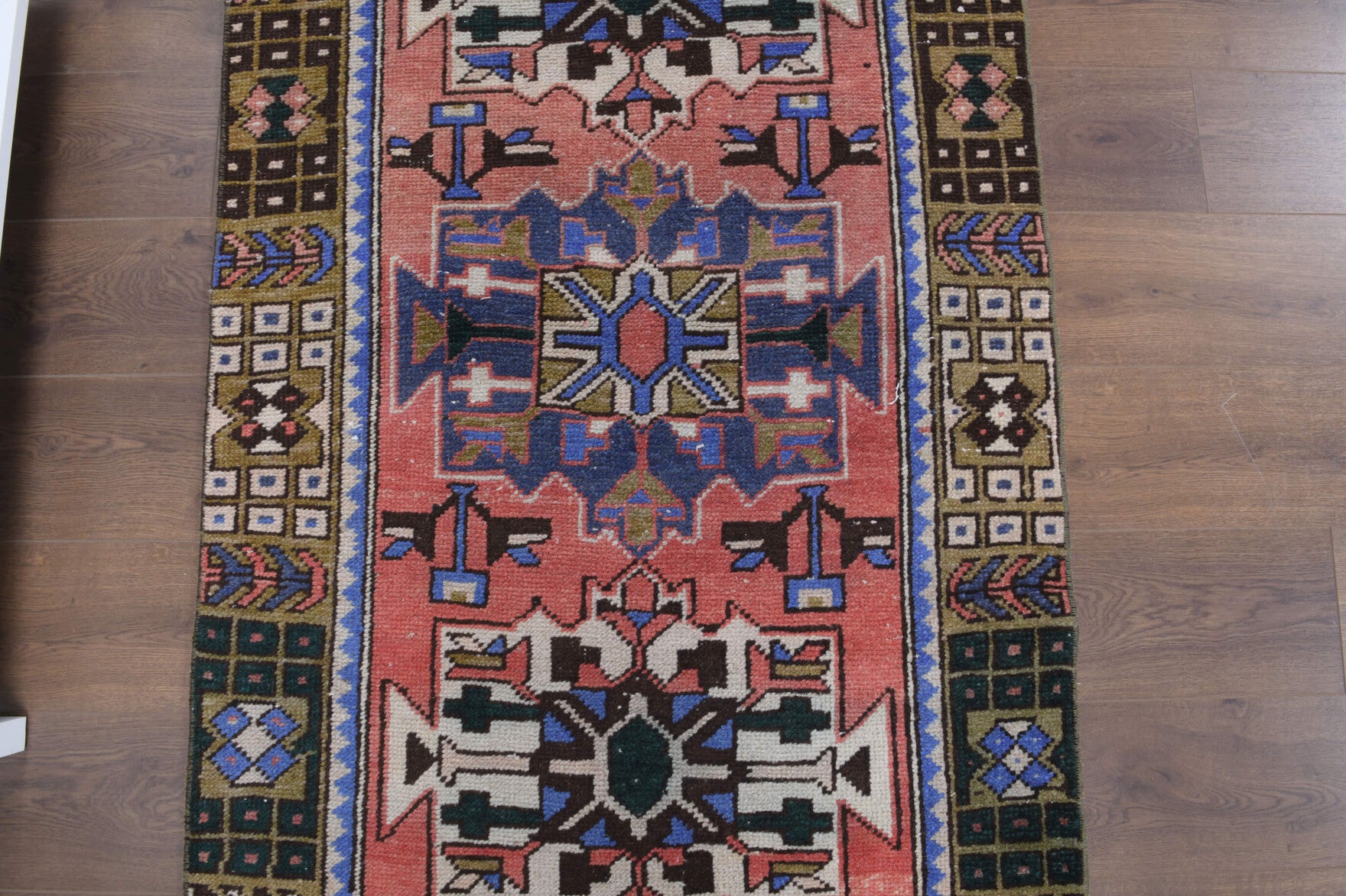 Halolampe runner: 1970s handmade Anatolian runner with oriental motifs and cotton backing