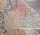 Cerenlale runner: 1960s handmade Anatolian runner with floral motifs and cotton backing
