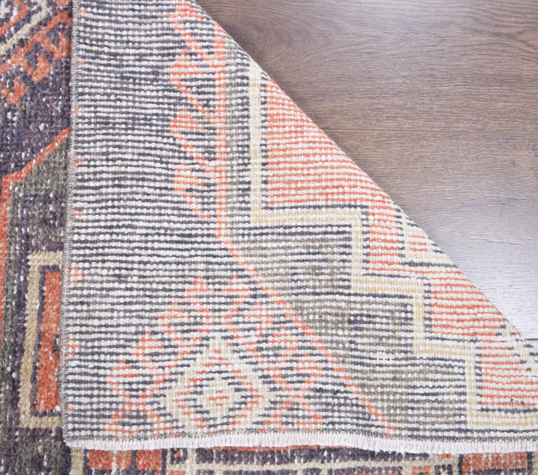Ebrusel rug: 1970s handmade Anatolian rug with geometric motifs and cotton backing