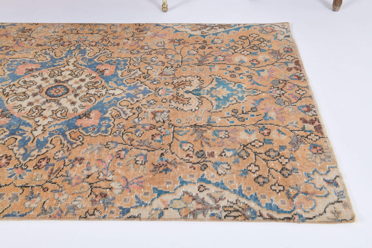Nisansena rug: 1970s handmade Anatolian rug with floral motifs and cotton backing