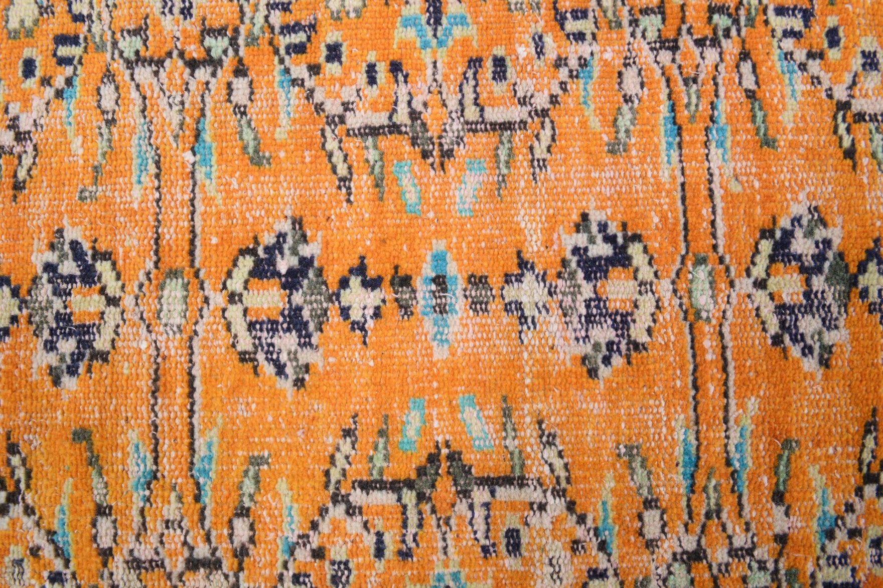 Hilalgul runner: 1970s handmade Anatolian runner with floral motifs and cotton backing