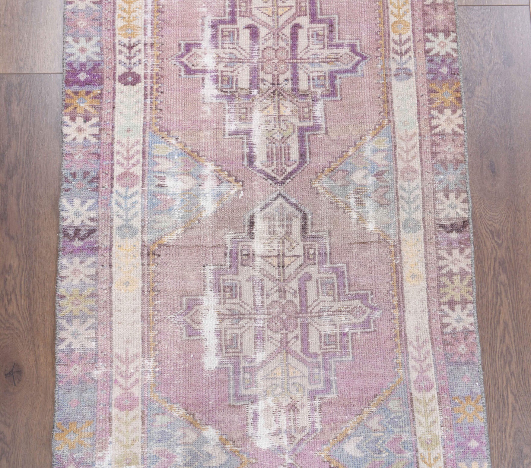 Renginbahar runner: 1970s handmade Anatolian runner with oriental motifs and cotton backing