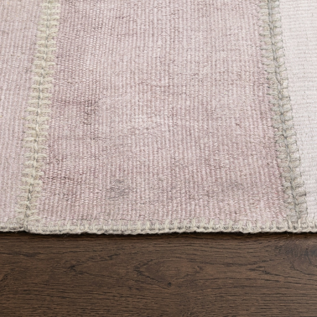 Solid pattern on the Petromelpe vintage patchwork area rug – handmade in Anatolia, Turkey