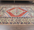 Nergisever rug: 1970s handmade Anatolian rug with oriental motifs and cotton backing