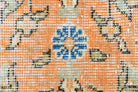 Fidan rug: 1970s handmade Anatolian rug with floral motifs and cotton backing