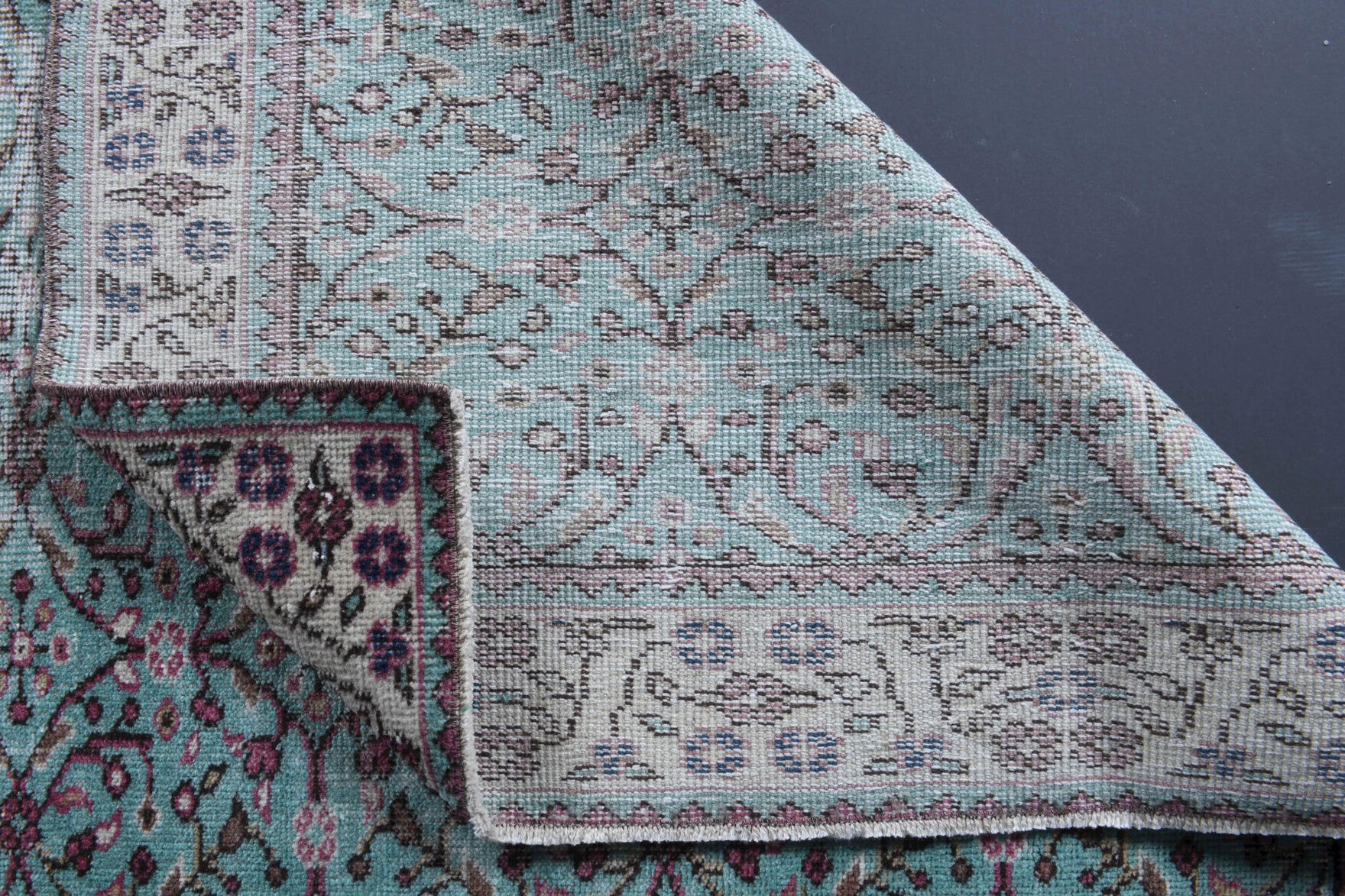 Delphiphaessa rug: 1970s handmade Anatolian rug with floral and bordered motifs and cotton backing