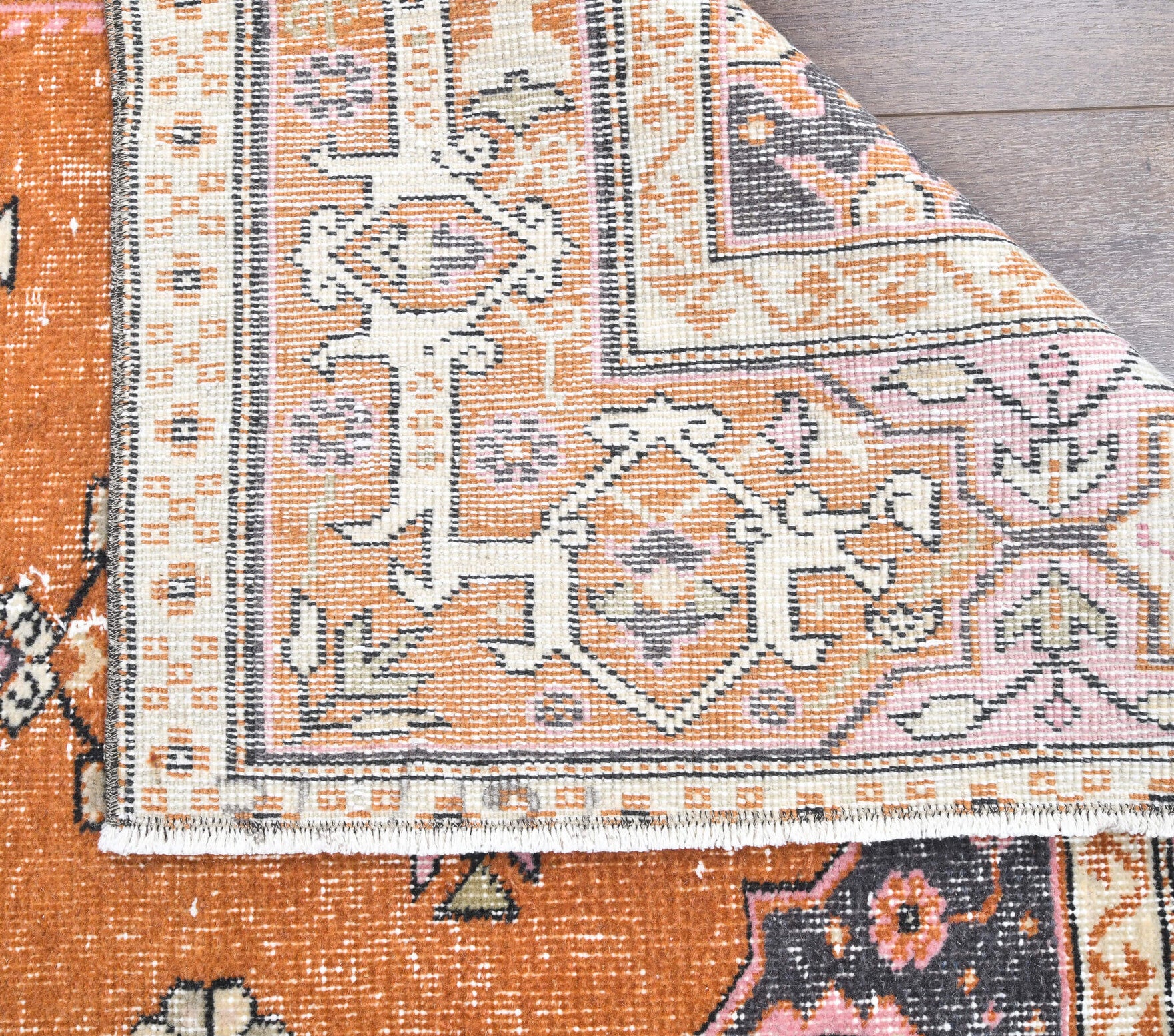 Gokgul rug: 1970s handmade Anatolian rug with bordered motifs and cotton backing