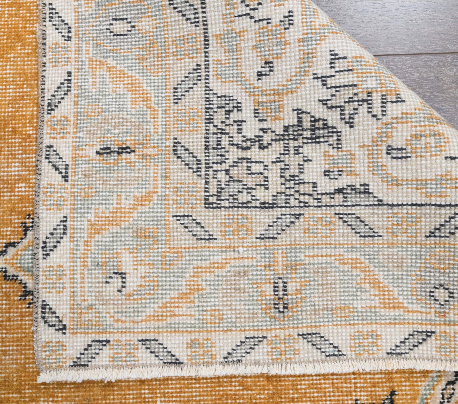 Polyphora rug: 1970s handmade Anatolian rug with floral motifs and cotton backing