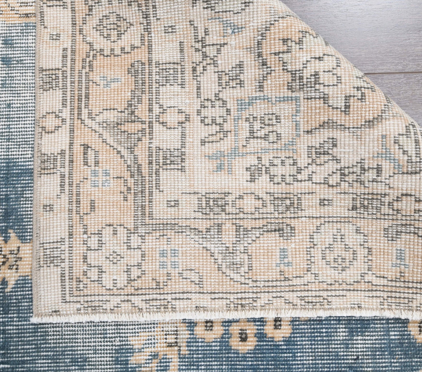 Rhea rug: 1960s handmade Anatolian rug with floral motifs and cotton backing