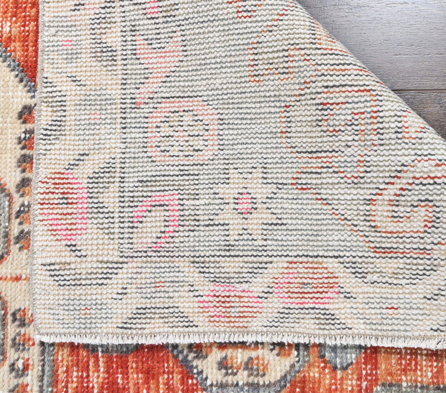 Saadet rug: 1970s handmade Anatolian rug with floral motifs and cotton backing