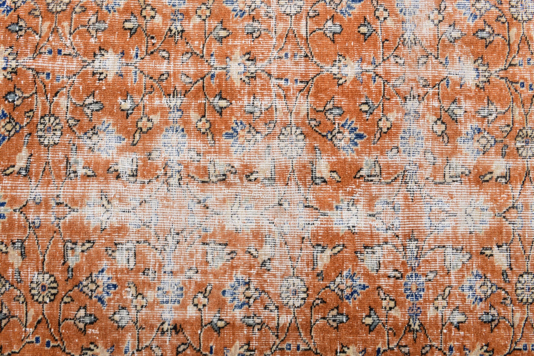 Okeanodora rug: 1970s handmade Anatolian rug with floral motifs and cotton backing