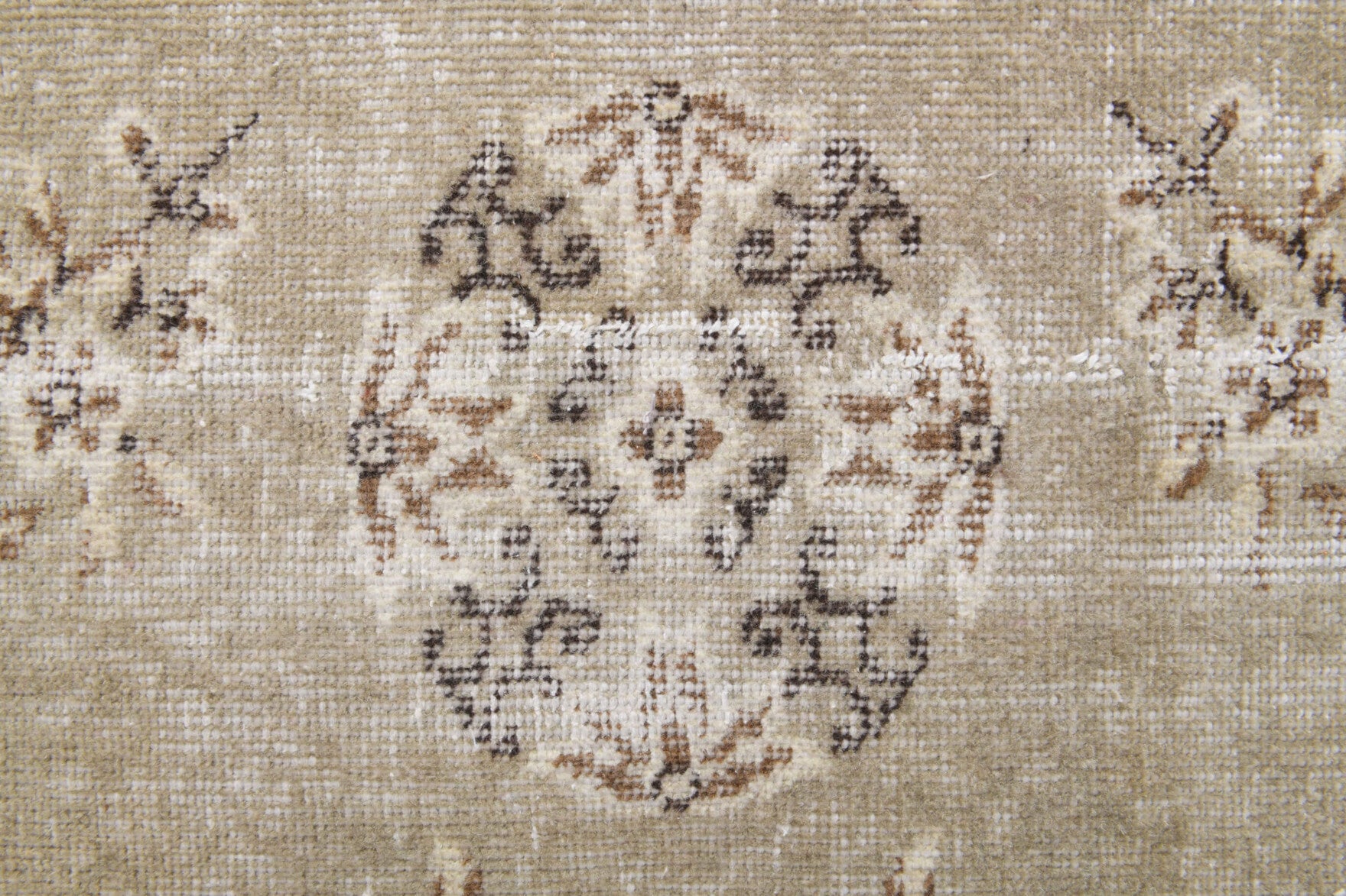 Gumusluk rug: 1970s handmade Anatolian rug with floral motifs and cotton backing