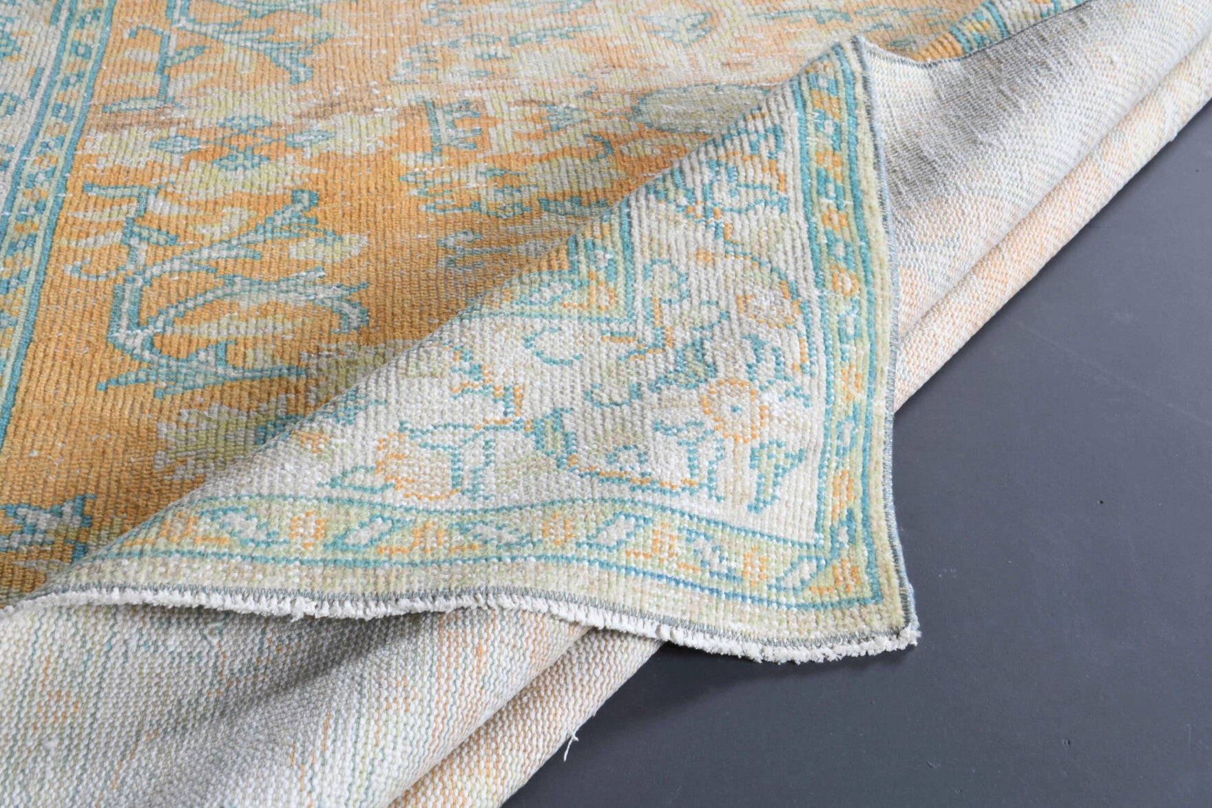 Fundaisik rug: 1970s handmade Anatolian rug with floral motifs and cotton backing