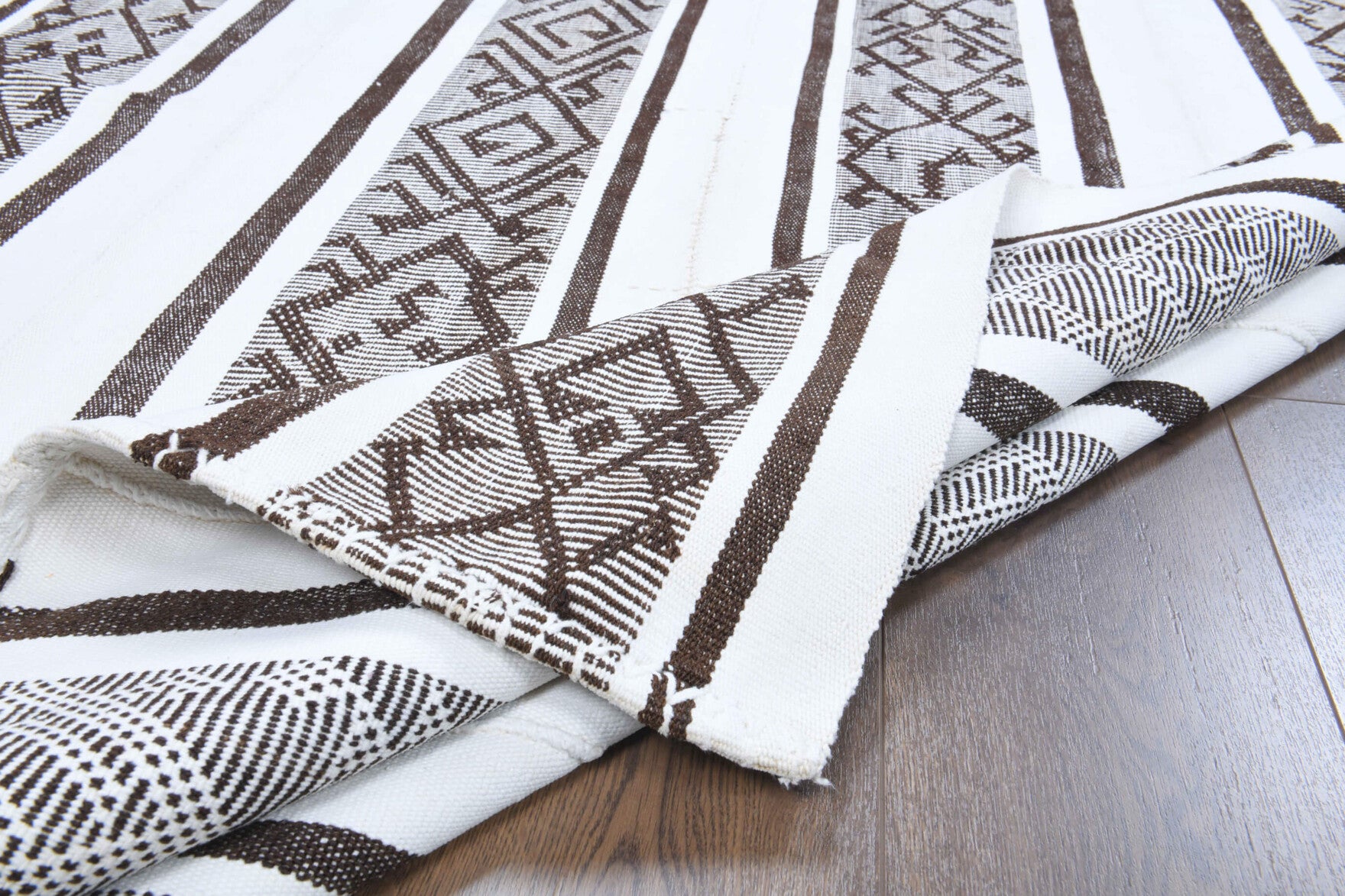 Berrakara kilim: 1960s handwoven flatweave Anatolian kilim with striped motifs and cotton backing