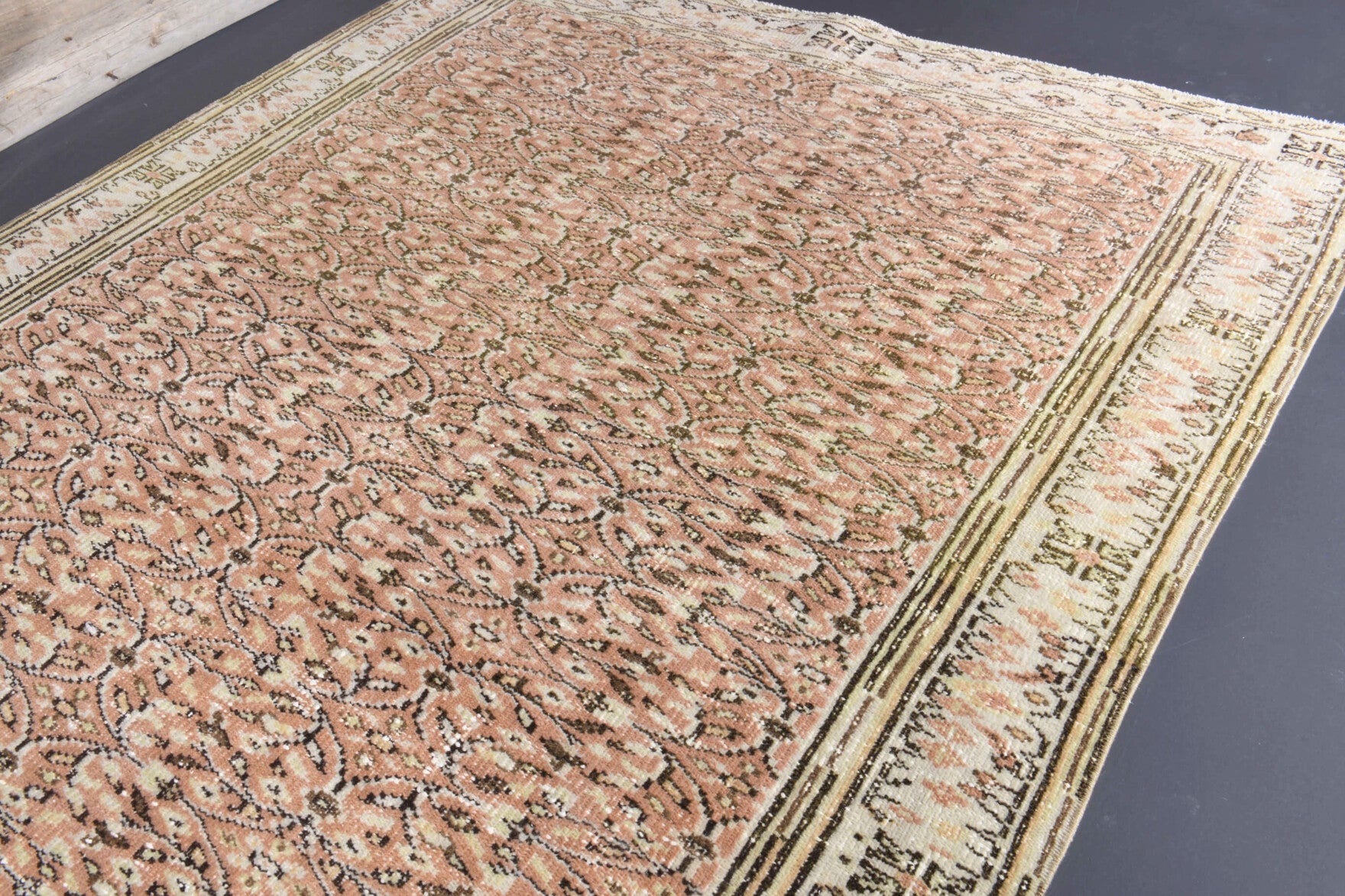 Filizsu rug: 1970s handmade Anatolian rug with floral bordered motifs and cotton backing