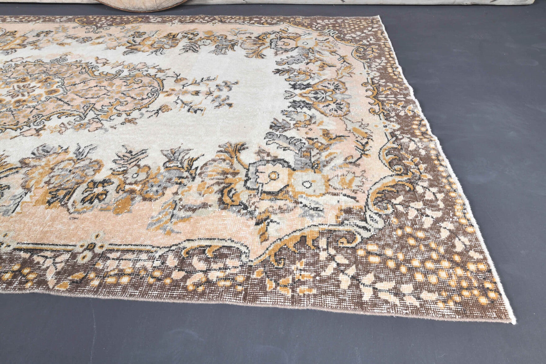 Aristodike rug: 1970s handmade Anatolian rug with floral motifs and cotton backing