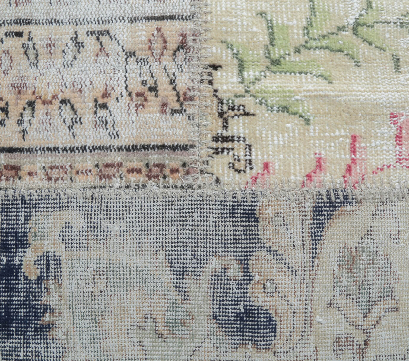 Hilalbahar rug: 1970s handmade Anatolian rug with patchwork motifs and fabric backing