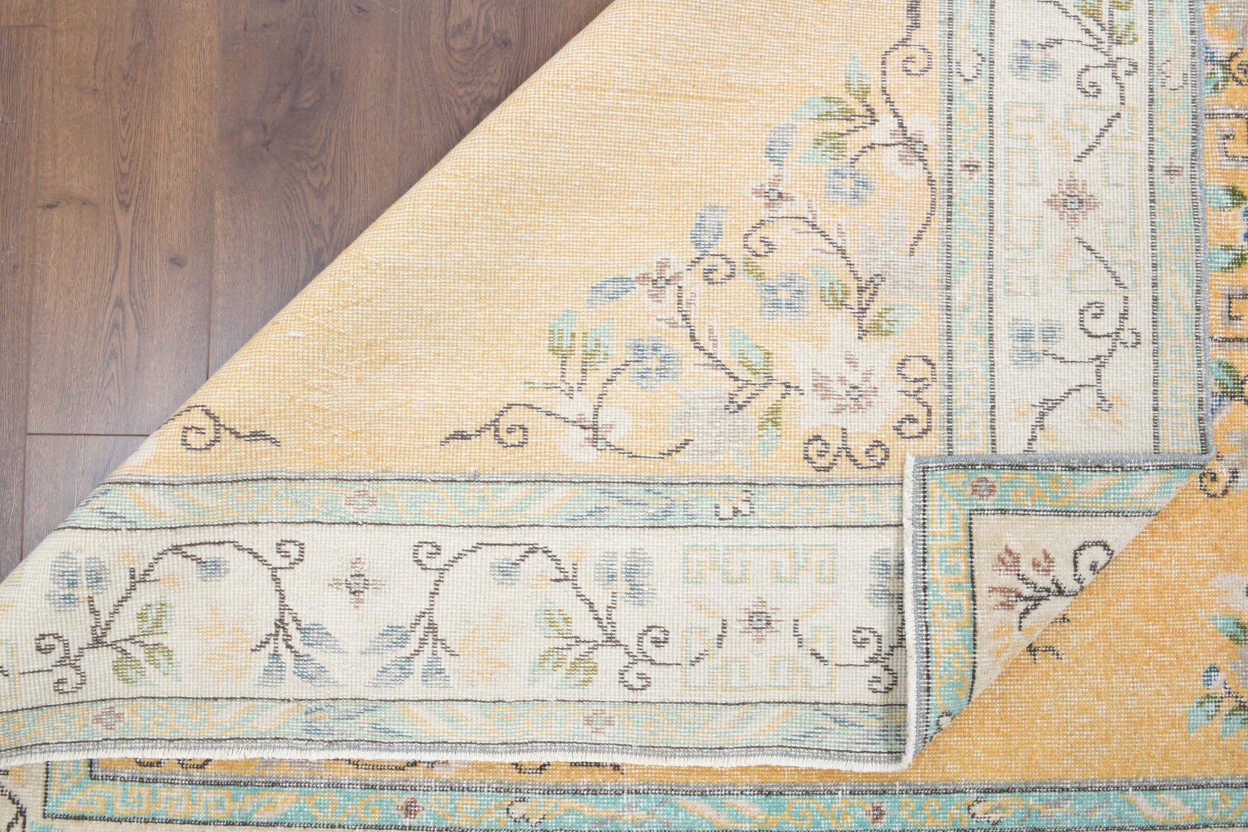 Goncasu rug: 1970s handmade Anatolian rug with medallion motifs and cotton backing