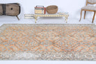 Nikomira rug: 1970s handmade Anatolian rug with bordered and floral motifs and cotton backing