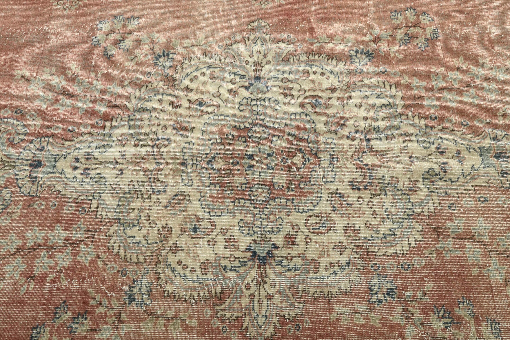 Bademnihal rug: 1970s handmade Anatolian rug with floral motifs and cotton backing