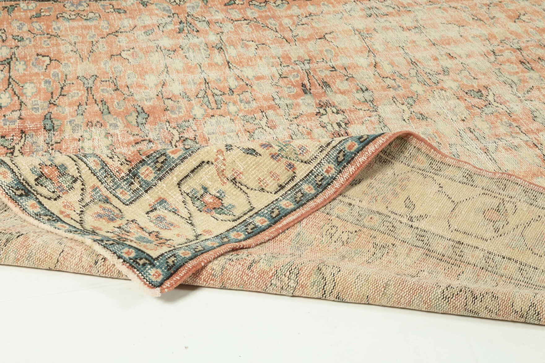 Authentic Anatolian distressed vintage area rug (1960s) with floral design – one-of-a-kind at Fame Rugs