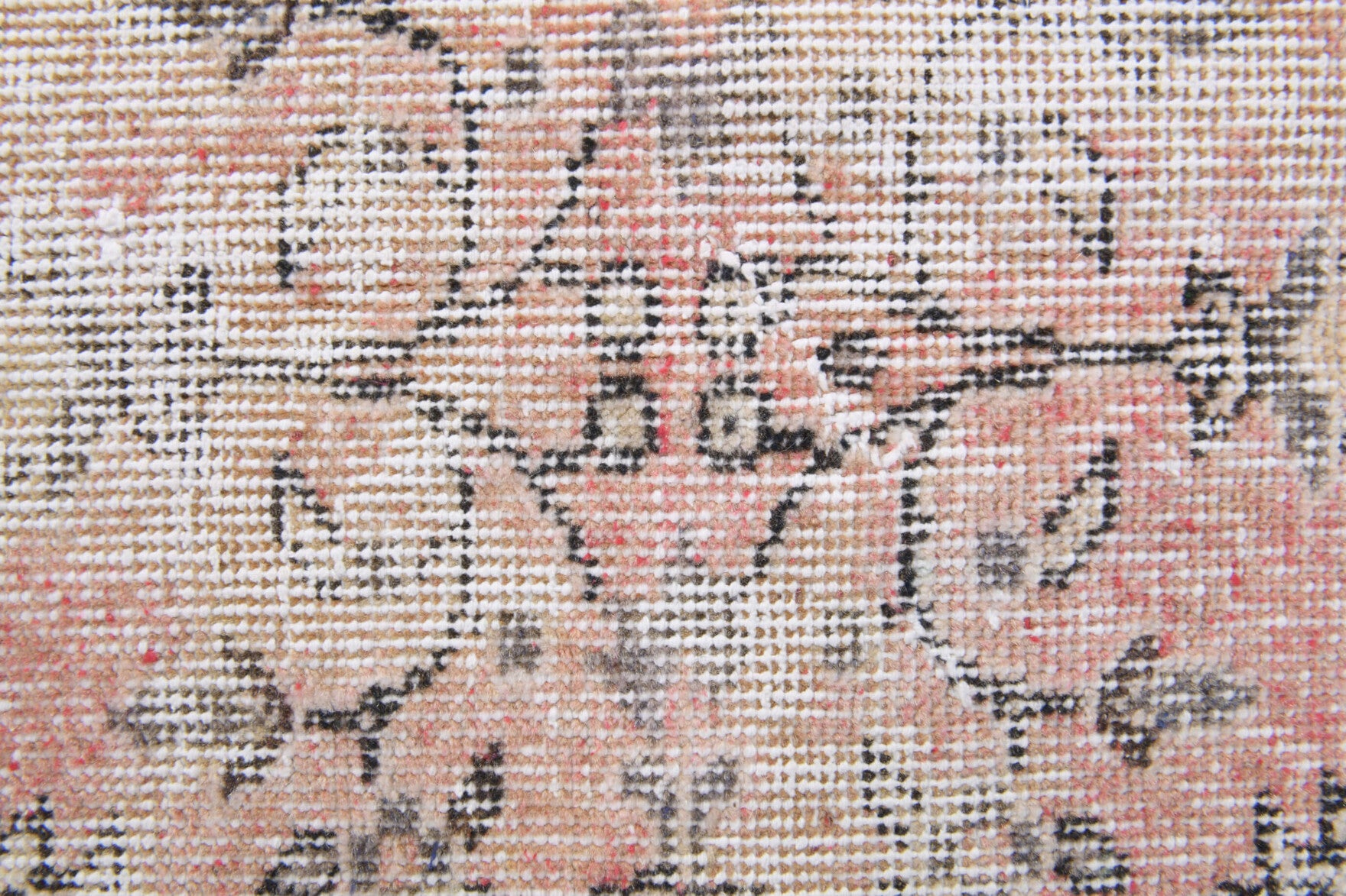 Zuhrenisin rug: 1960s handmade Anatolian rug with floral motifs and cotton backing