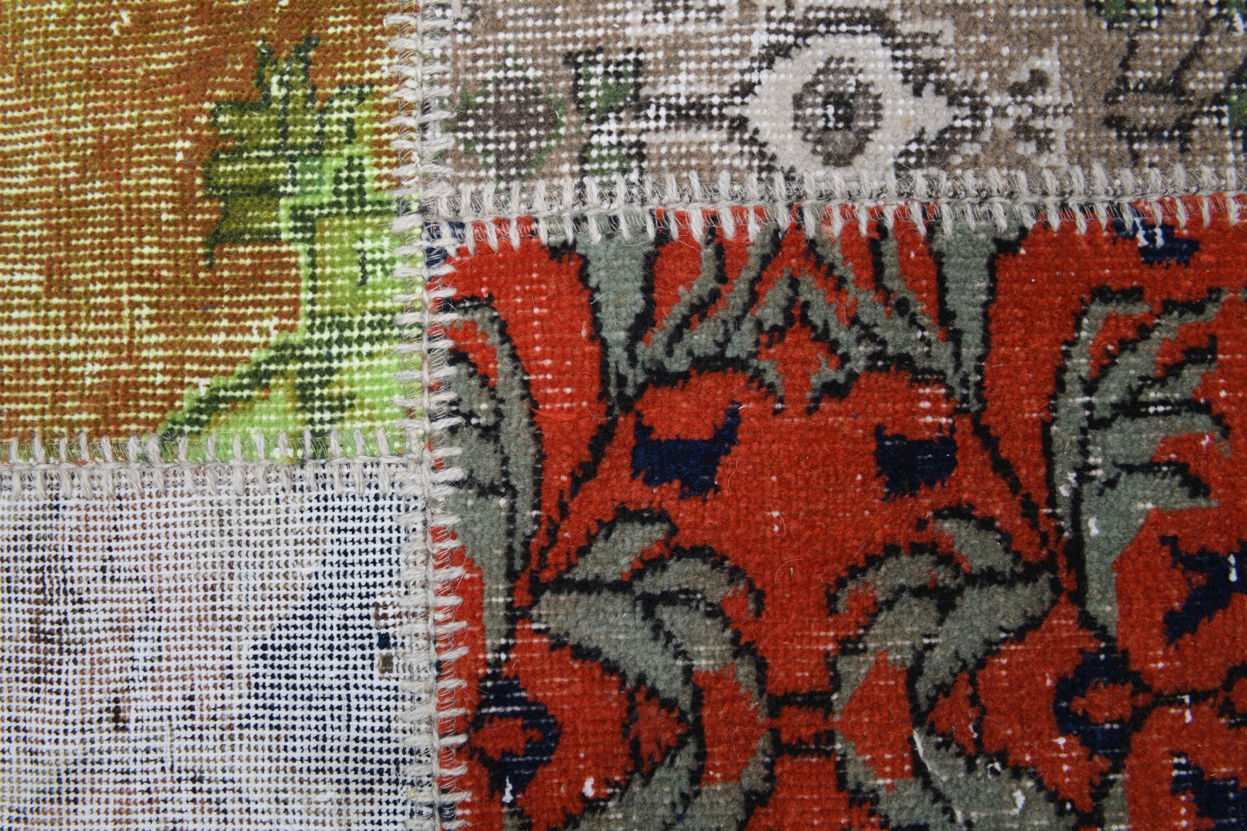 Ambrosthene rug: 1970s handmade Anatolian rug with floral motifs and fabric backing