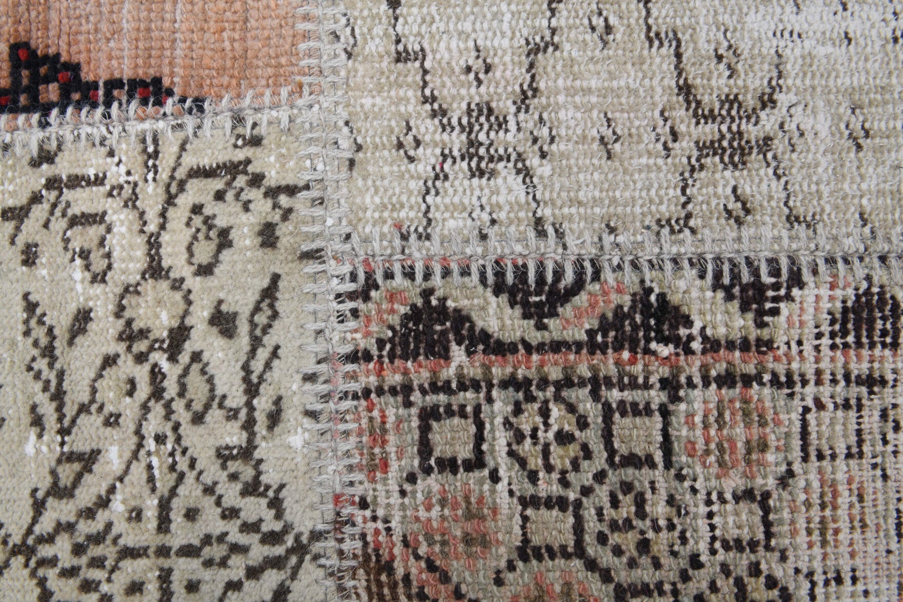 Ambrolyra rug: 1970s handmade Anatolian rug with tribal motifs and fabric backing