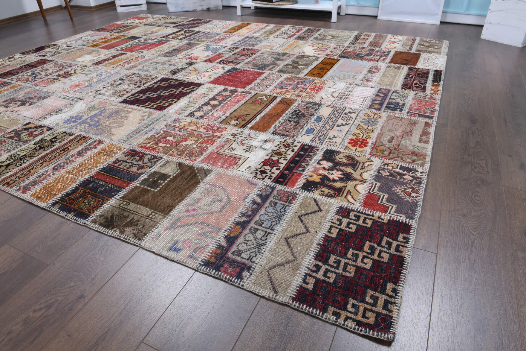 Anemozoe rug: 1970s handmade Anatolian rug with tribal motifs and fabric backing