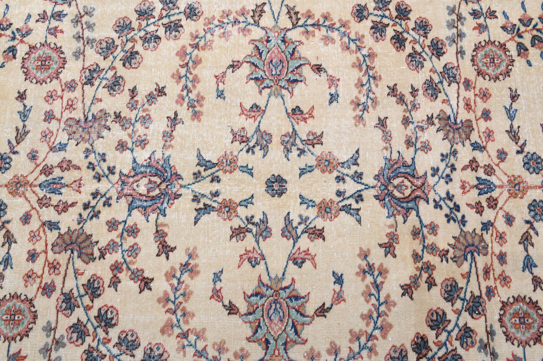 Adaisik rug: 1970s handmade Anatolian rug with bordered and floral motifs and cotton backing