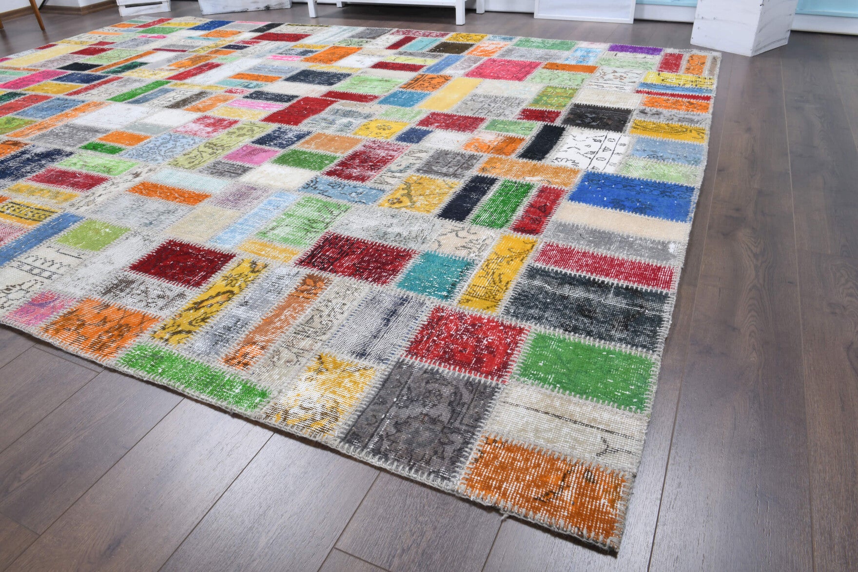 Anthogena rug: 1970s handmade Anatolian rug with tribal motifs and fabric backing