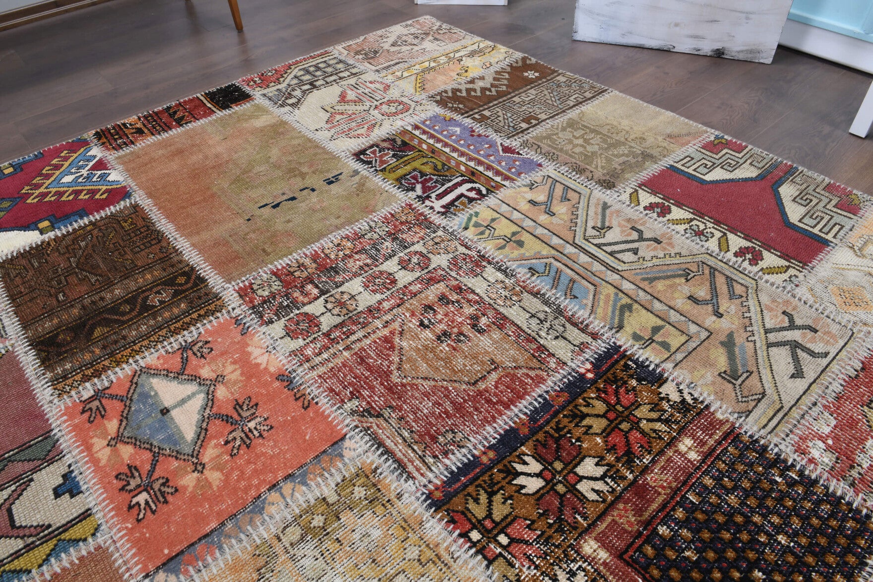 Akikter rug: 1970s handmade Anatolian rug with tribal motifs and fabric backing