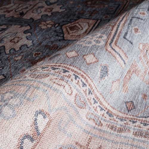 Close-up of a patterned rug with intricate designs. Cream Rugs - Fame Rugs