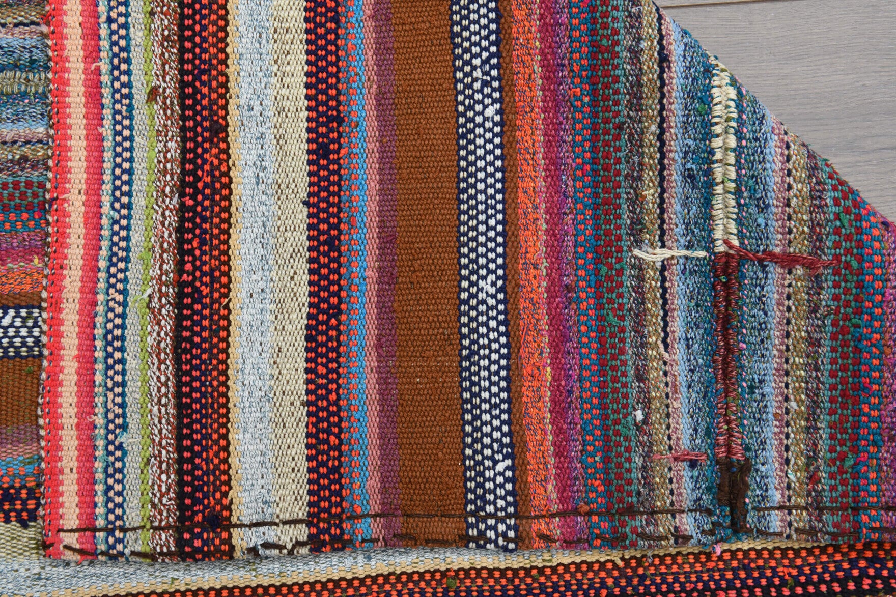Nehirumut kilim: 1960s handwoven flatweave Anatolian kilim with striped motifs and fabric backing