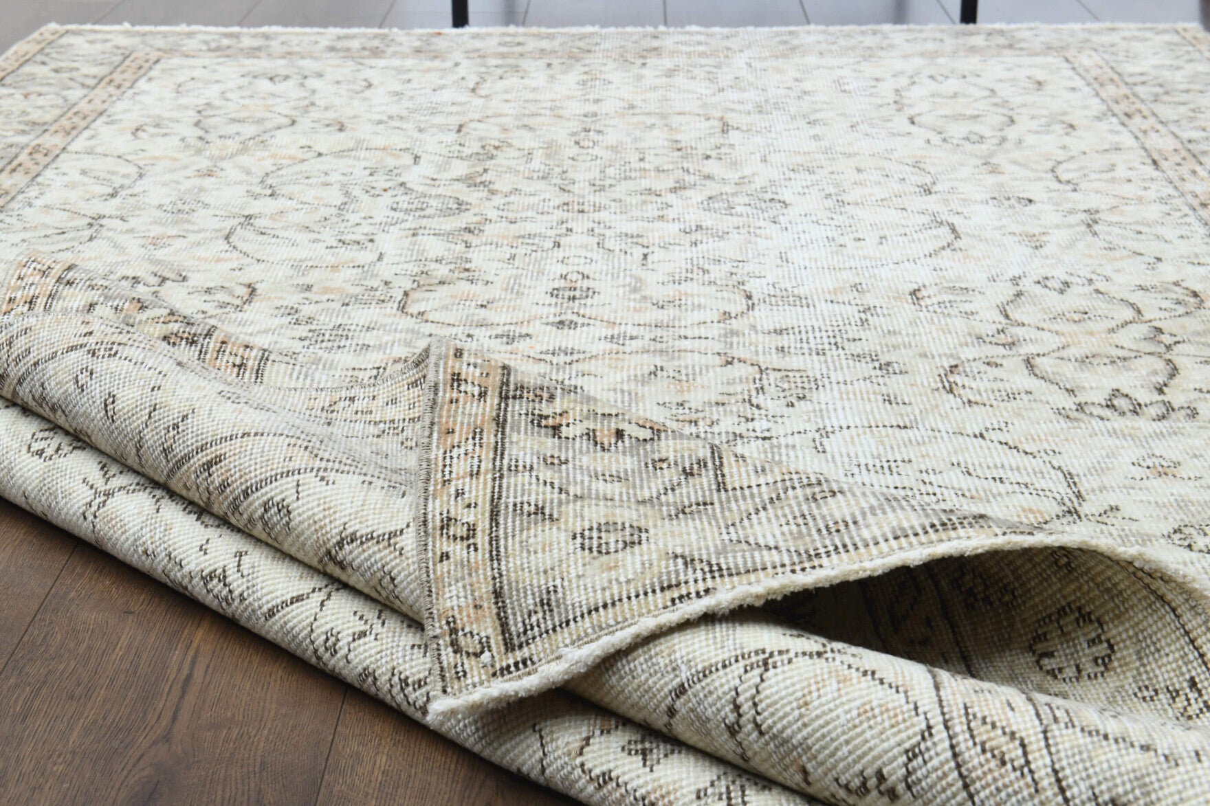 Zeyneplale rug: 1970s handmade Anatolian rug with floral motifs and cotton backing