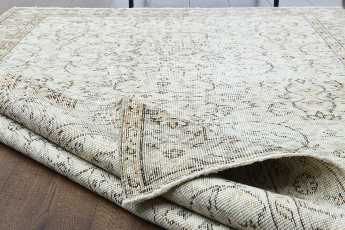 Zeyneplale rug: 1970s handmade Anatolian rug with floral motifs and cotton backing