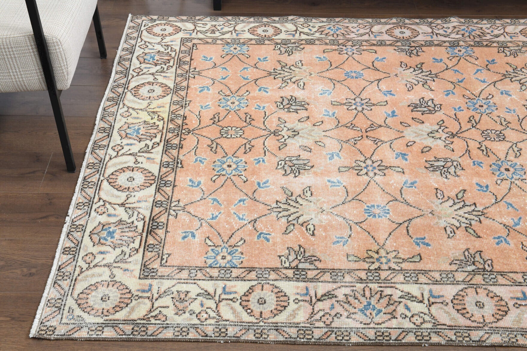 Eirenekleia rug: 1970s handmade Anatolian rug with floral motifs and cotton backing