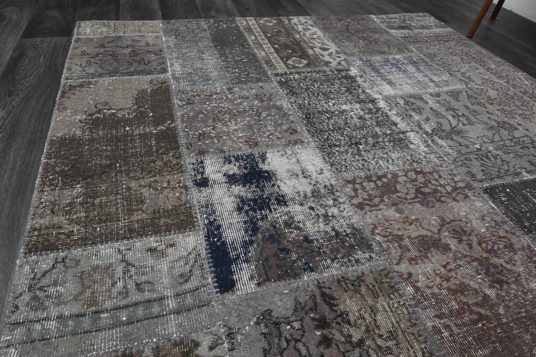 Chrysophile rug: 1980s handmade Anatolian rug with floral motifs and fabric backing