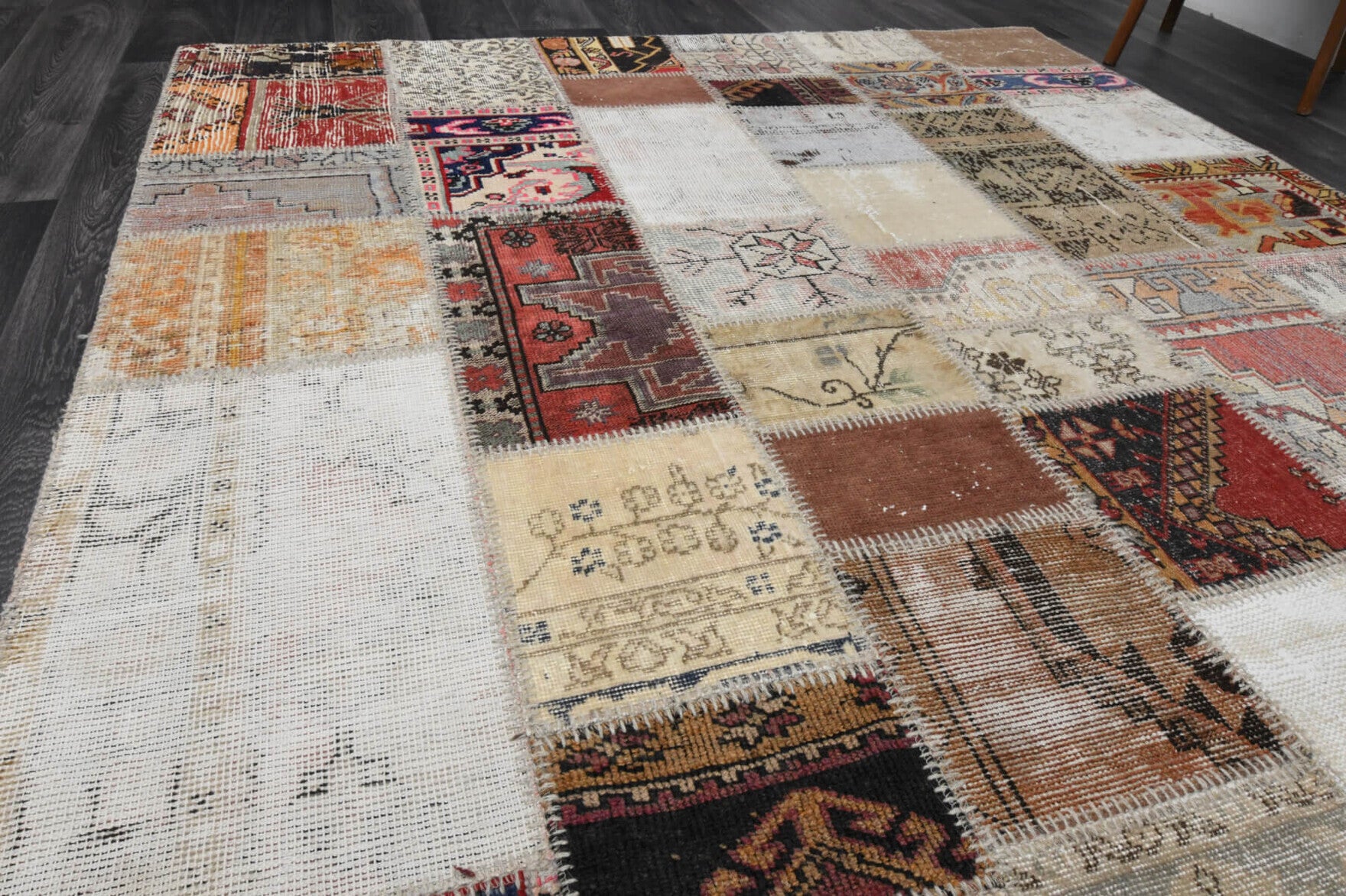 Caglanaz rug: 1980s handmade Anatolian rug with solid motifs and fabric backing