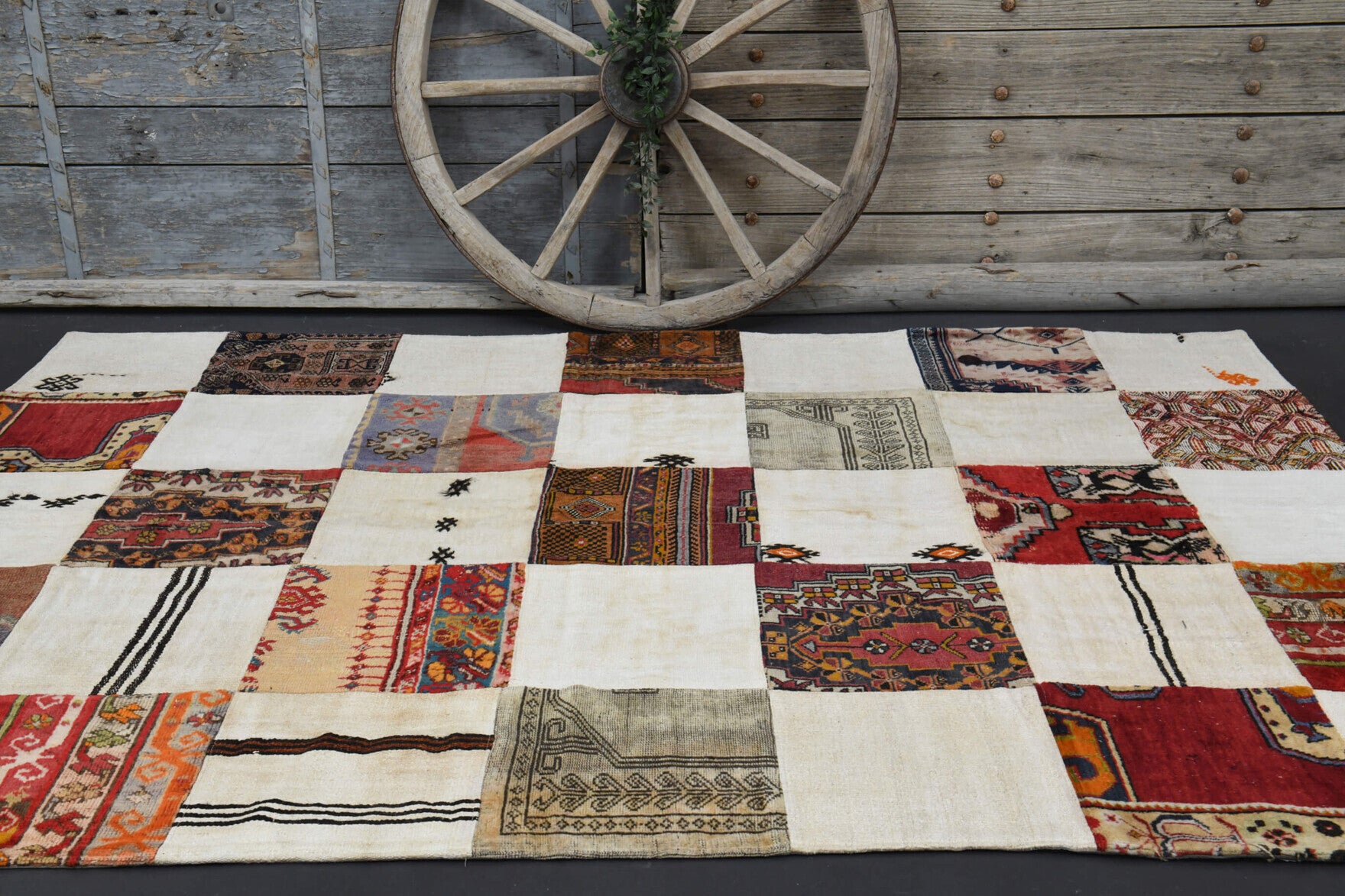 Astrapetra rug: 1970s handmade Anatolian rug with ikat motifs and fabric backing