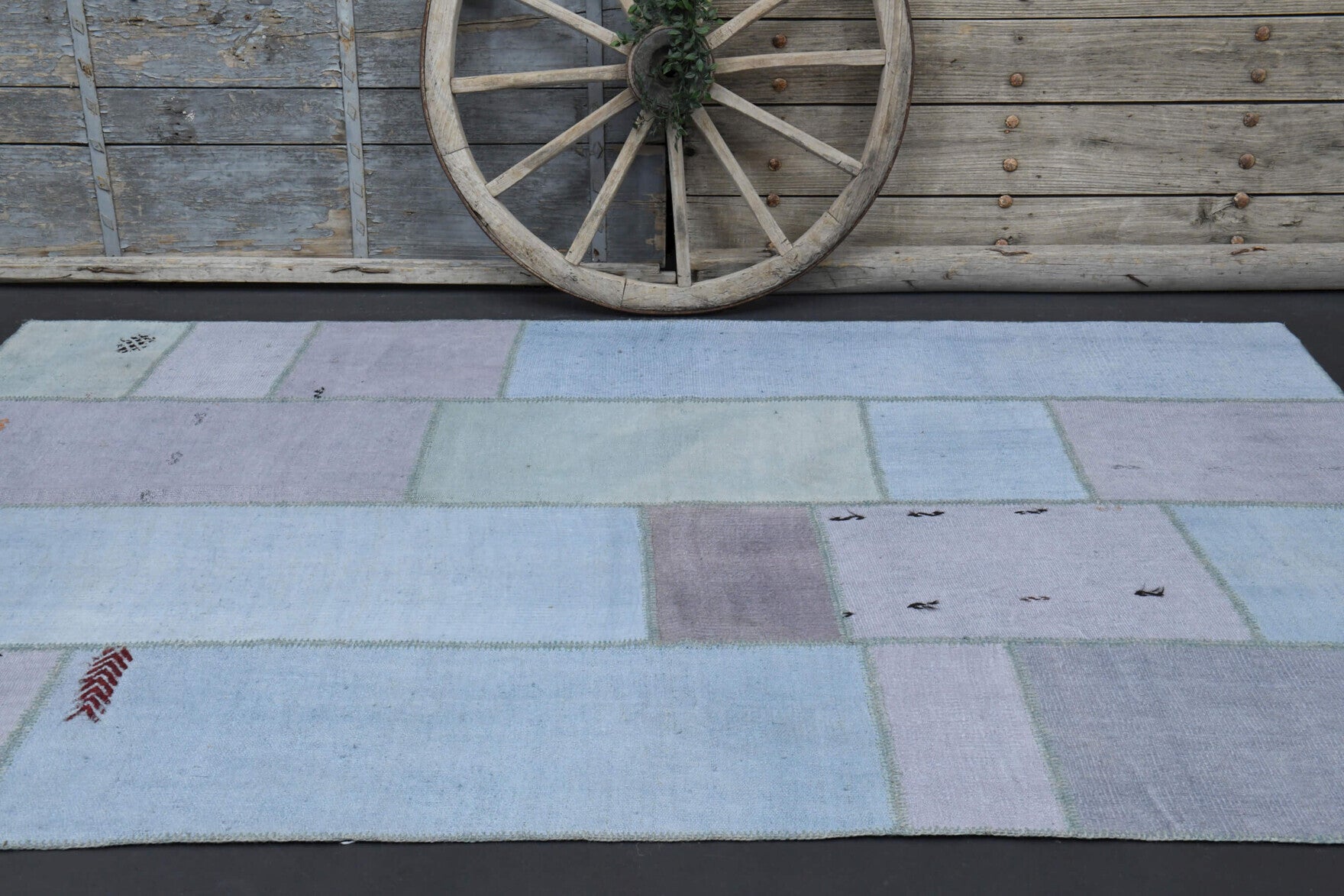 Aristophyllis rug: 1960s handmade Anatolian rug with oriental motifs and fabric backing