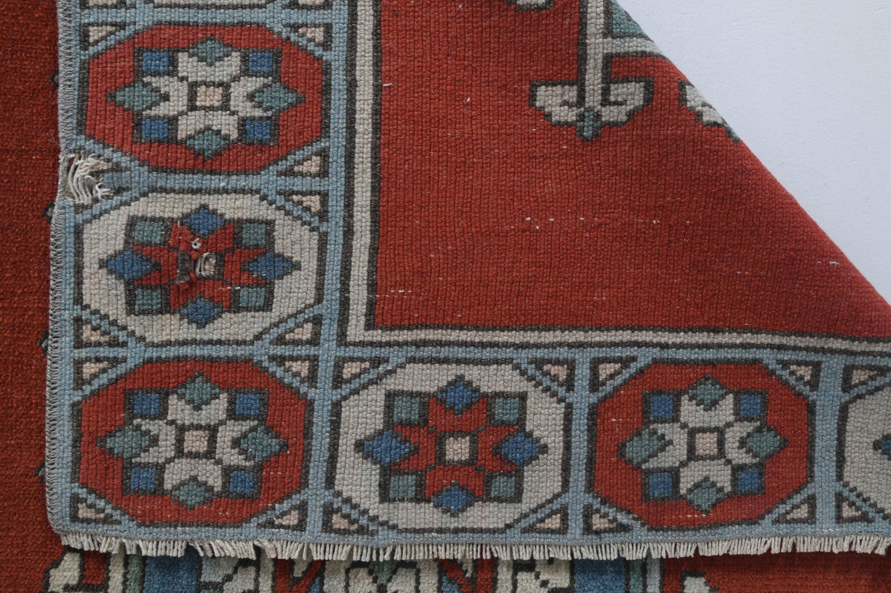 Sibelnur rug: 1970s handmade Anatolian rug with ikat motifs and cotton backing