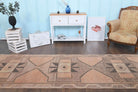 Tarabike runner: 1970s handmade Anatolian runner with tribal motifs and cotton backing