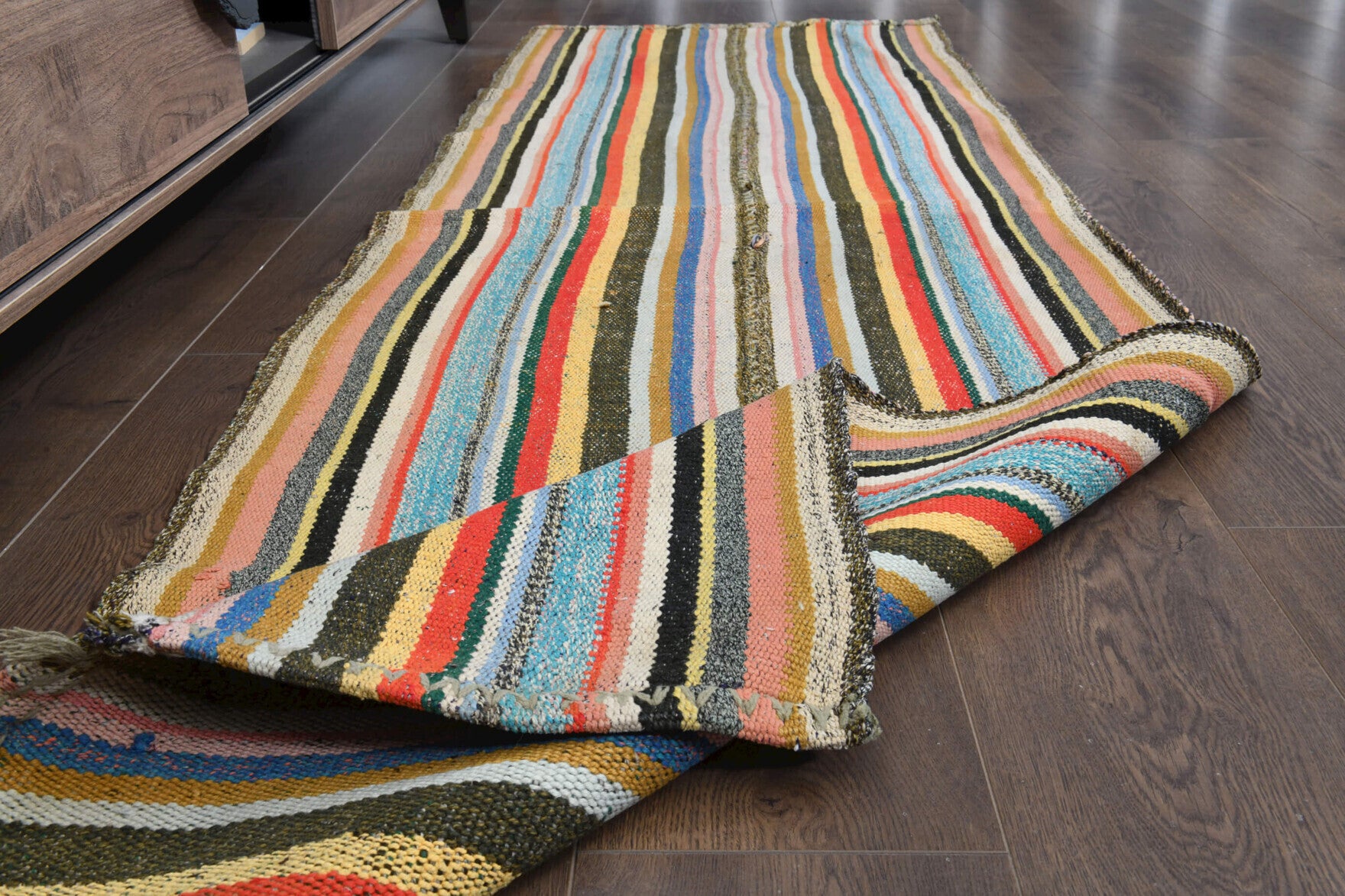 Hazanihal kilim: 1960s handwoven flatweave Anatolian kilim with striped motifs and fabric backing